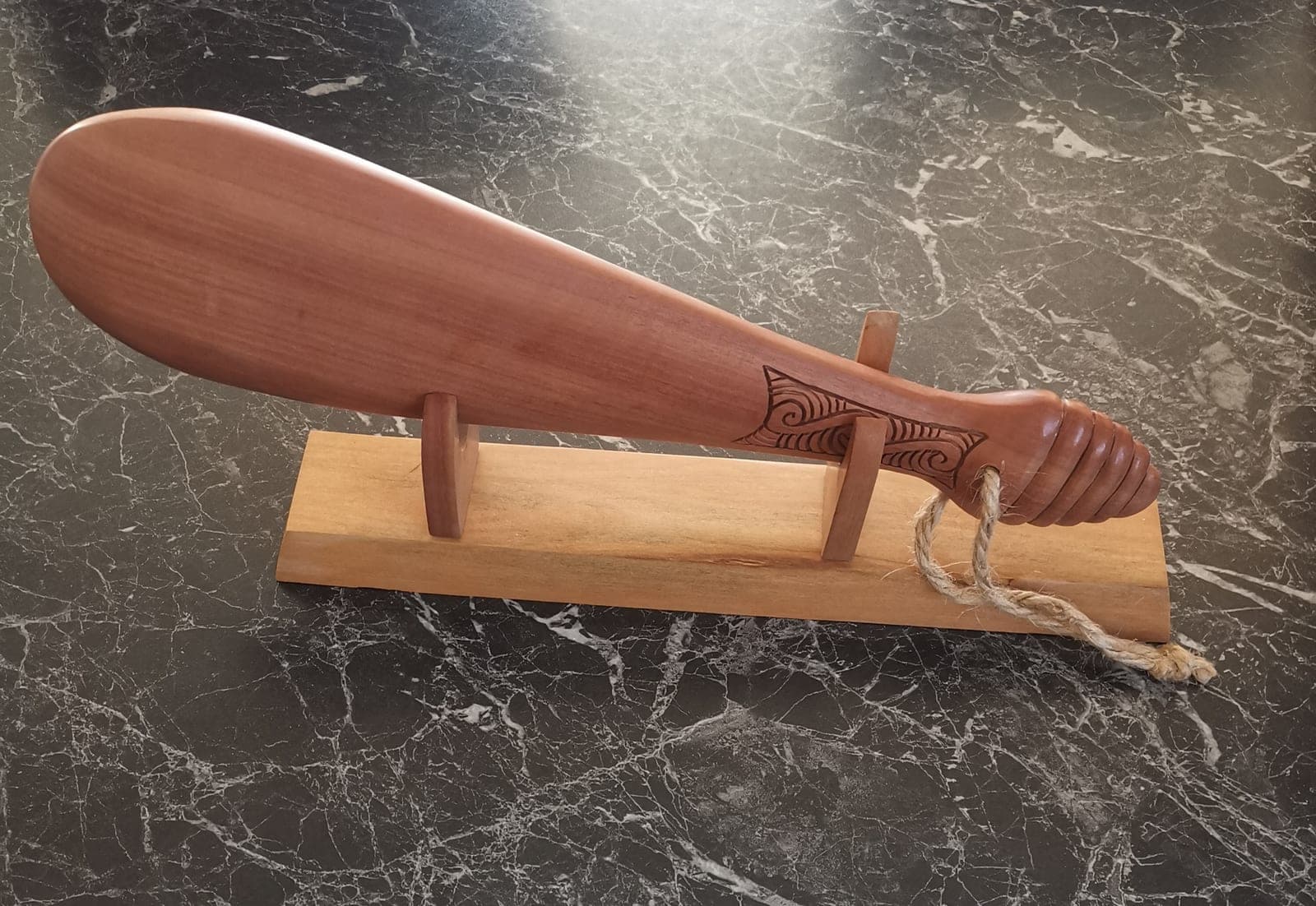 Wooden Patu on stand