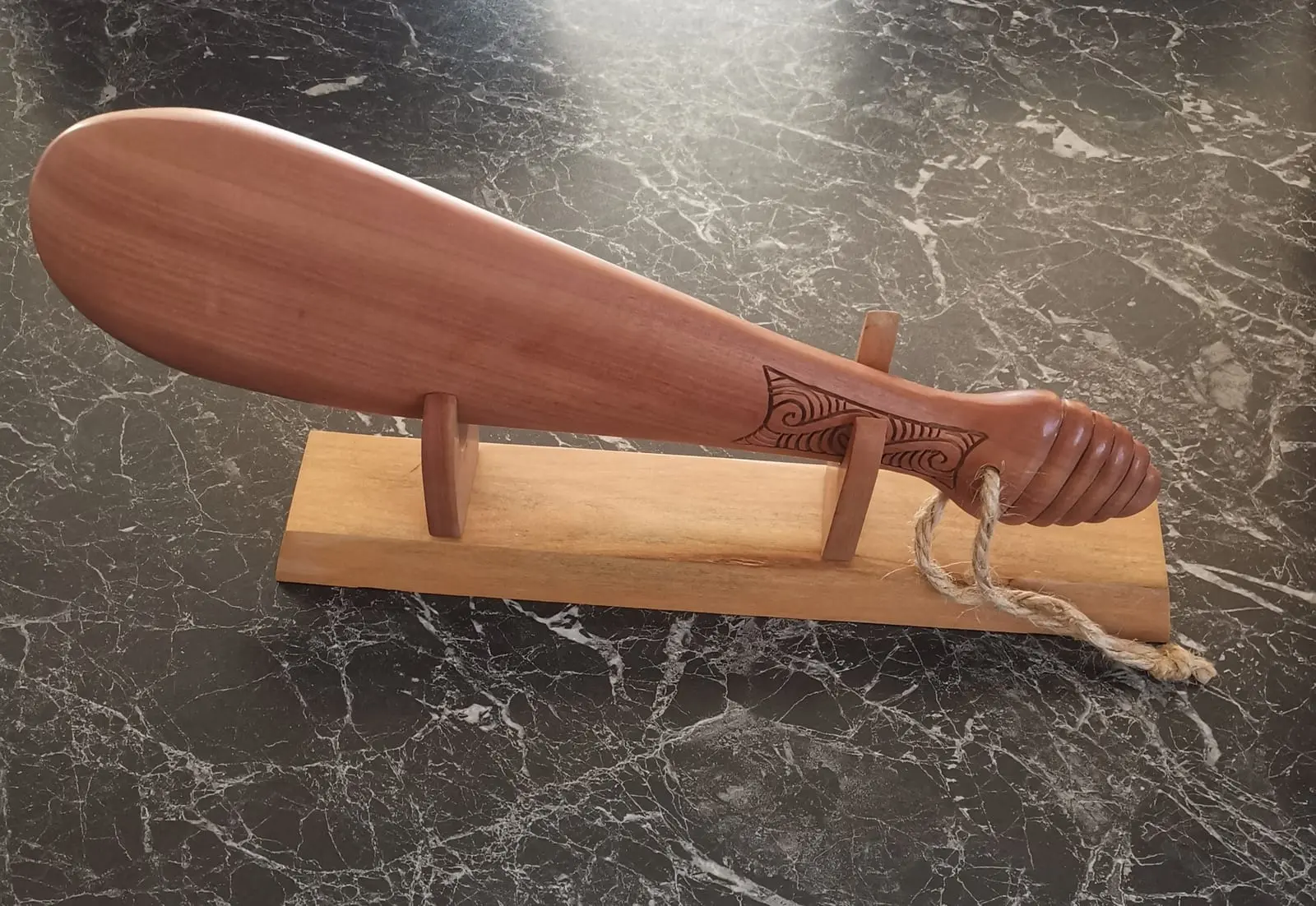 Wooden Patu on stand